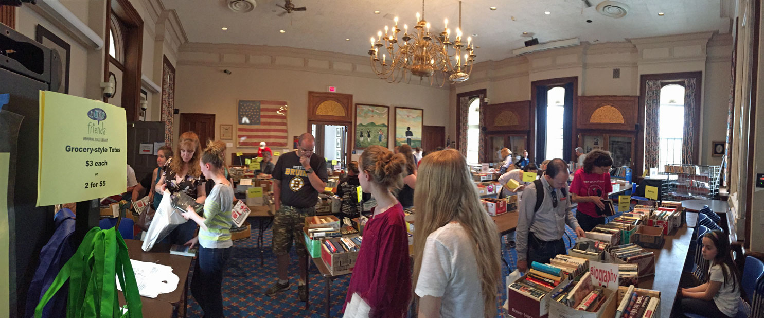 community members browse tables filled with books